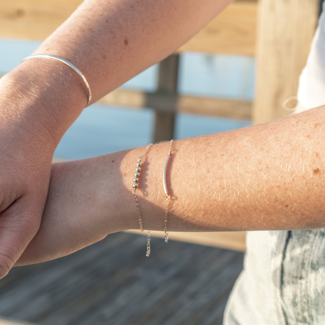 Curved bar and five bead bracelets in sterling silver or 14k gold filled