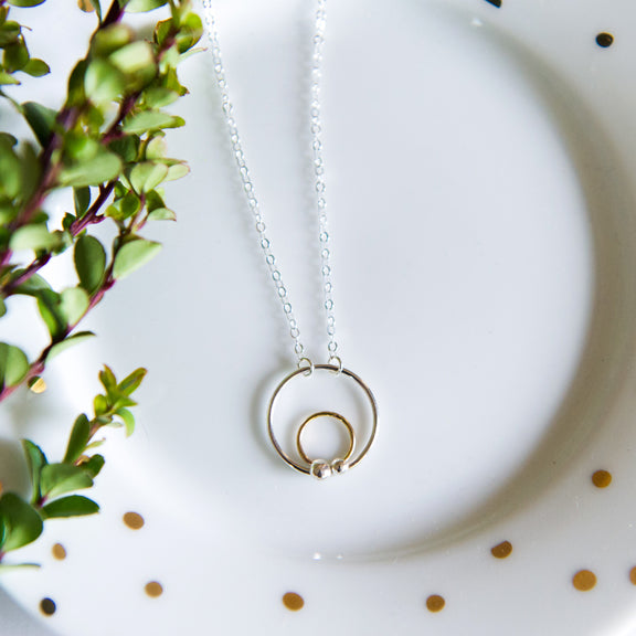 Mixed metal circle necklace in sterling silver and 14k gold filled